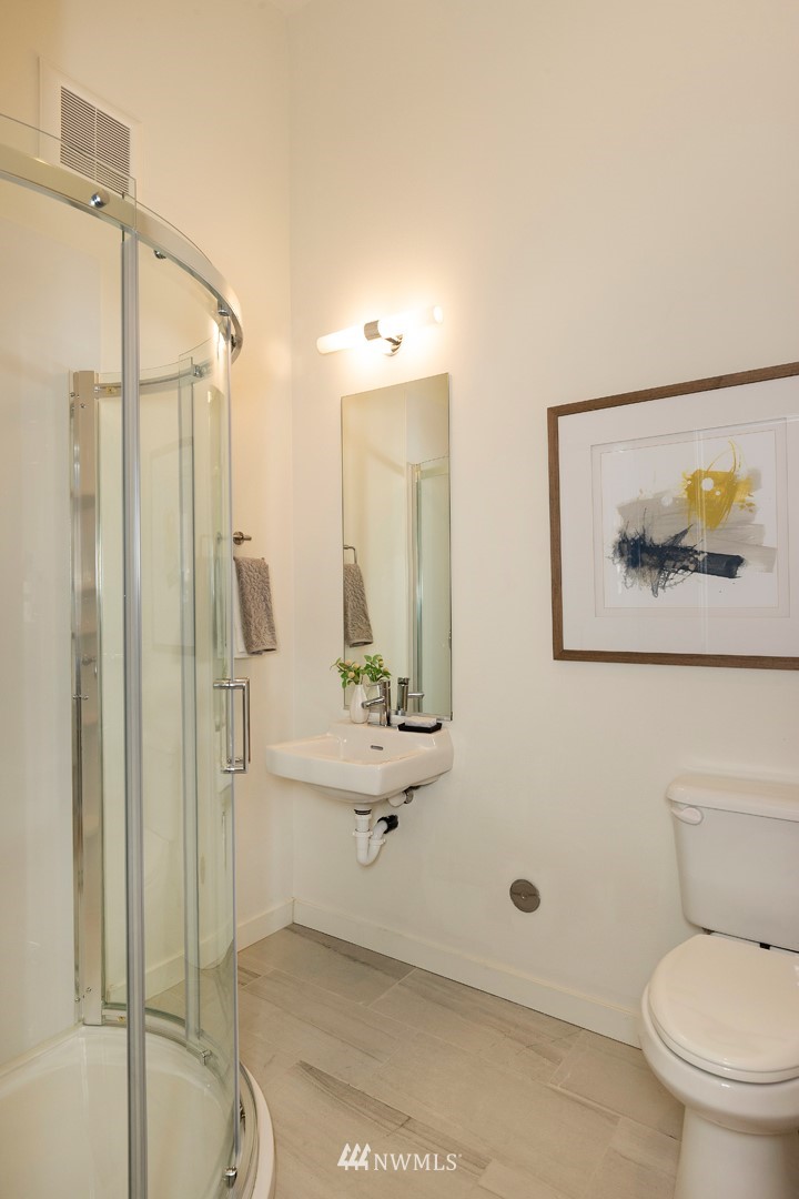 6012 A California Avenue Southwest Seattle, WA 98136 - Photo 5 of 30 a bathroom with a toilet sink and shower