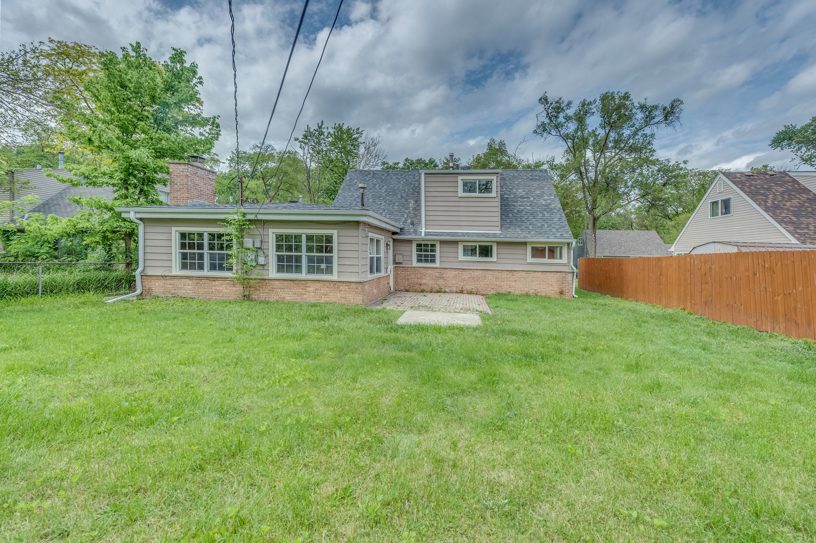 407 Watseka Street Park Forest, IL 60466 - Photo 21 of 21 a view of a house with a yard and potted plants