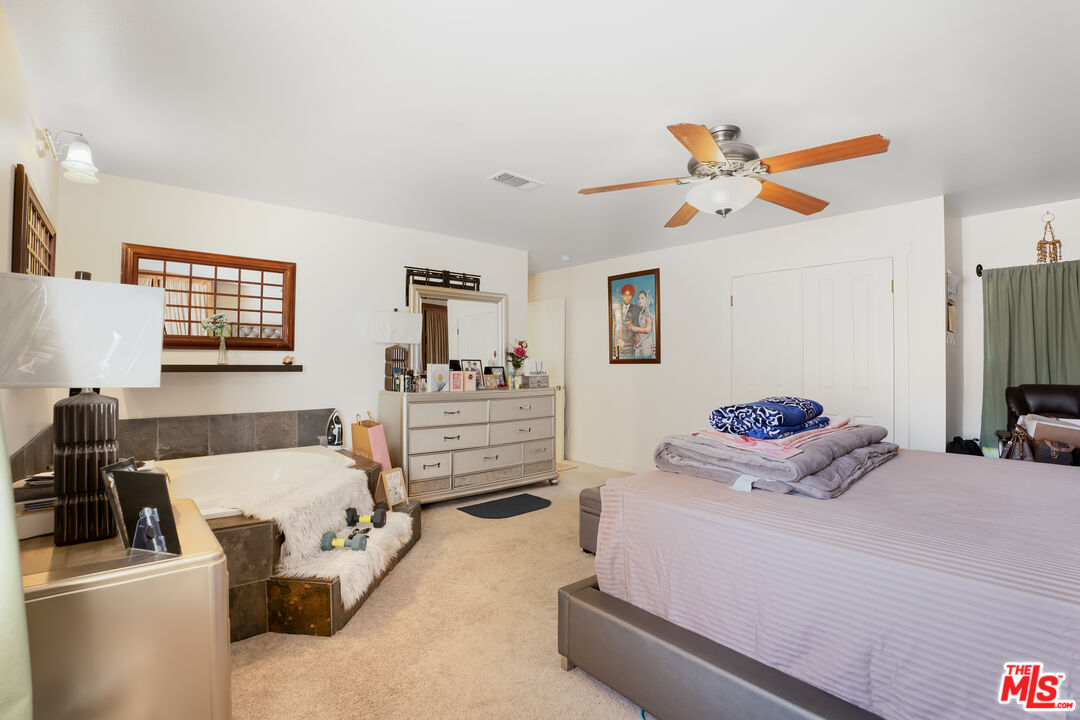 4141 Eileen Street Simi Valley, CA 93063 - Photo 15 of 31 a bedroom with a bed and furniture