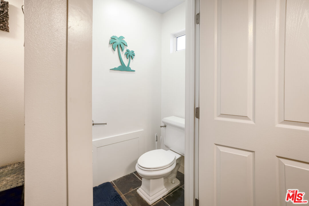 4141 Eileen Street Simi Valley, CA 93063 - Photo 20 of 31 a white toilet sitting next to a shower
