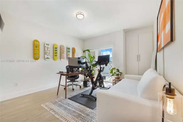 a living room with furniture flowerpot and a chandelier