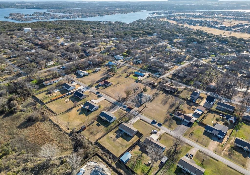 513 Ranch Road Granbury, TX 76049 - Photo 8 of 9 an aerial view of residential building with parking