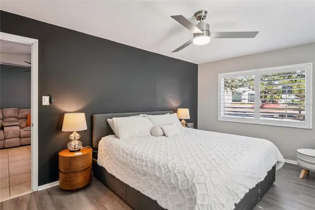 a bedroom with a bed and window