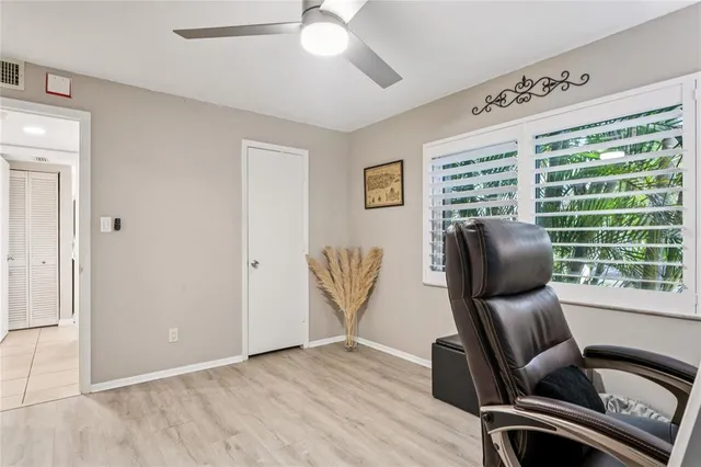 a view of workspace with furniture and a window