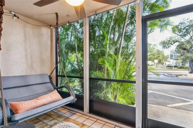 a room with furniture and a potted plant