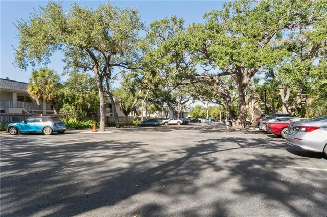 a view of street with parked cars
