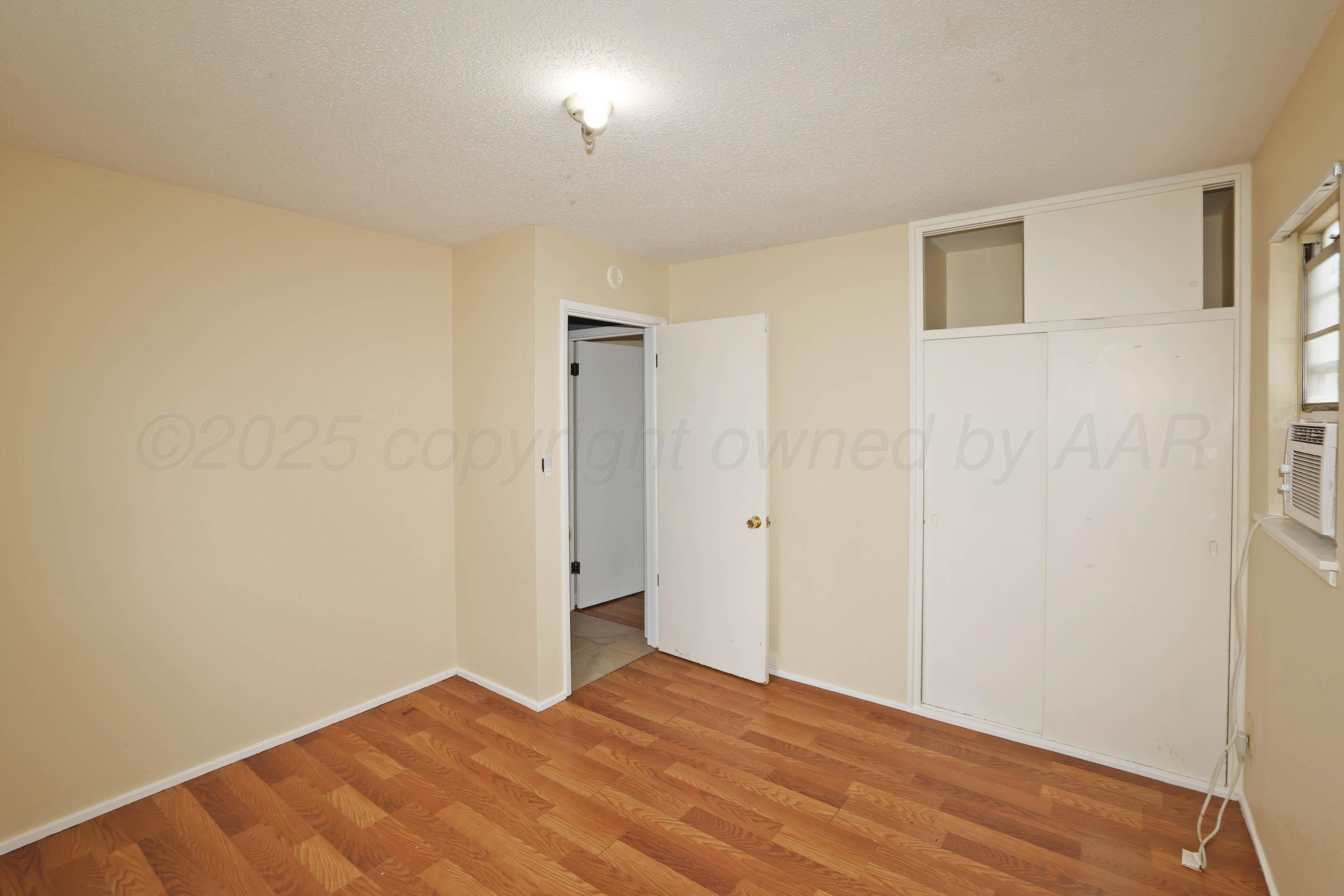 3810 Mesa Verde Drive Amarillo, TX 79107 - Photo 15 of 21 a view of empty room with wooden floor