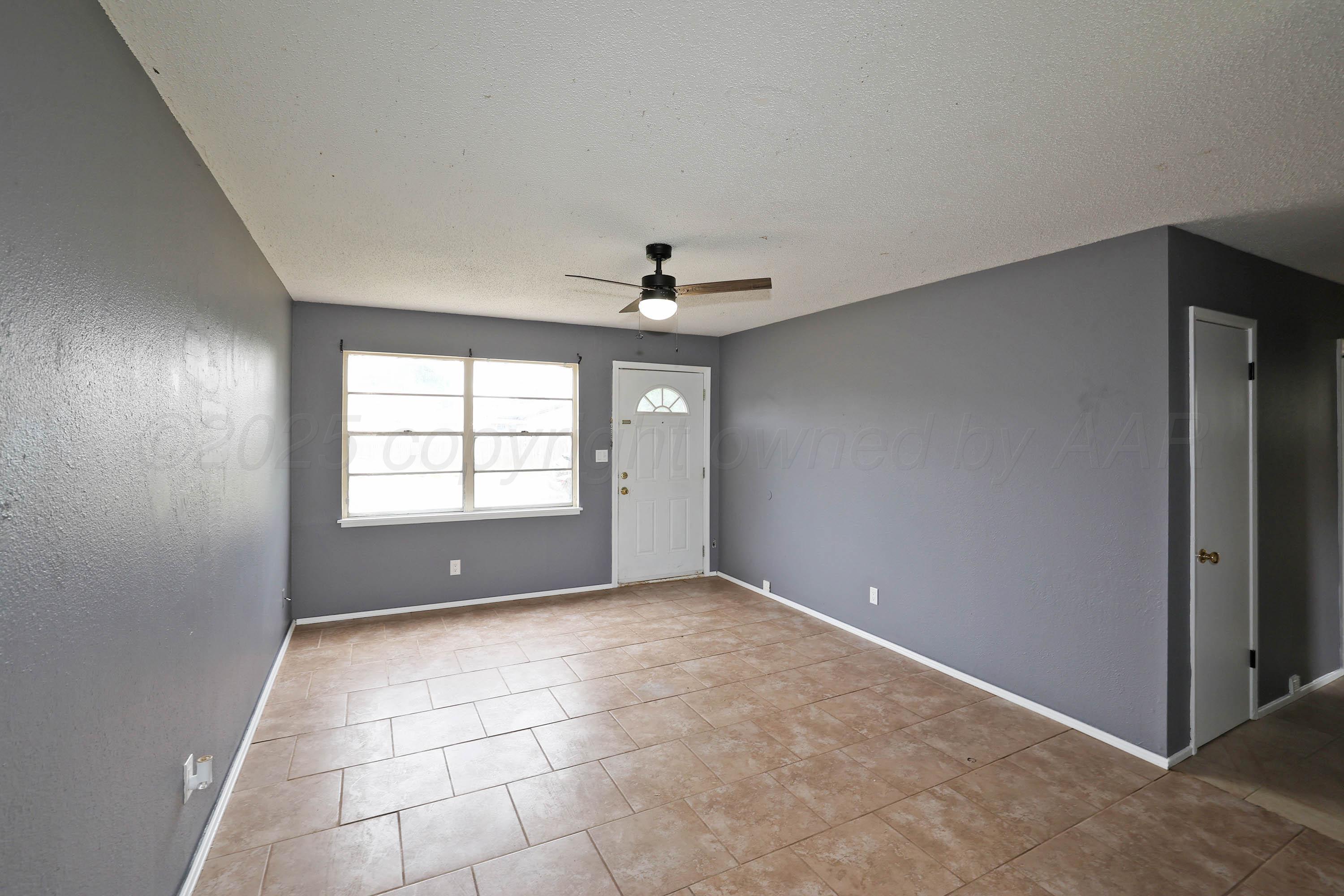 3810 Mesa Verde Drive Amarillo, TX 79107 - Photo 4 of 21 a view of an empty room with a window