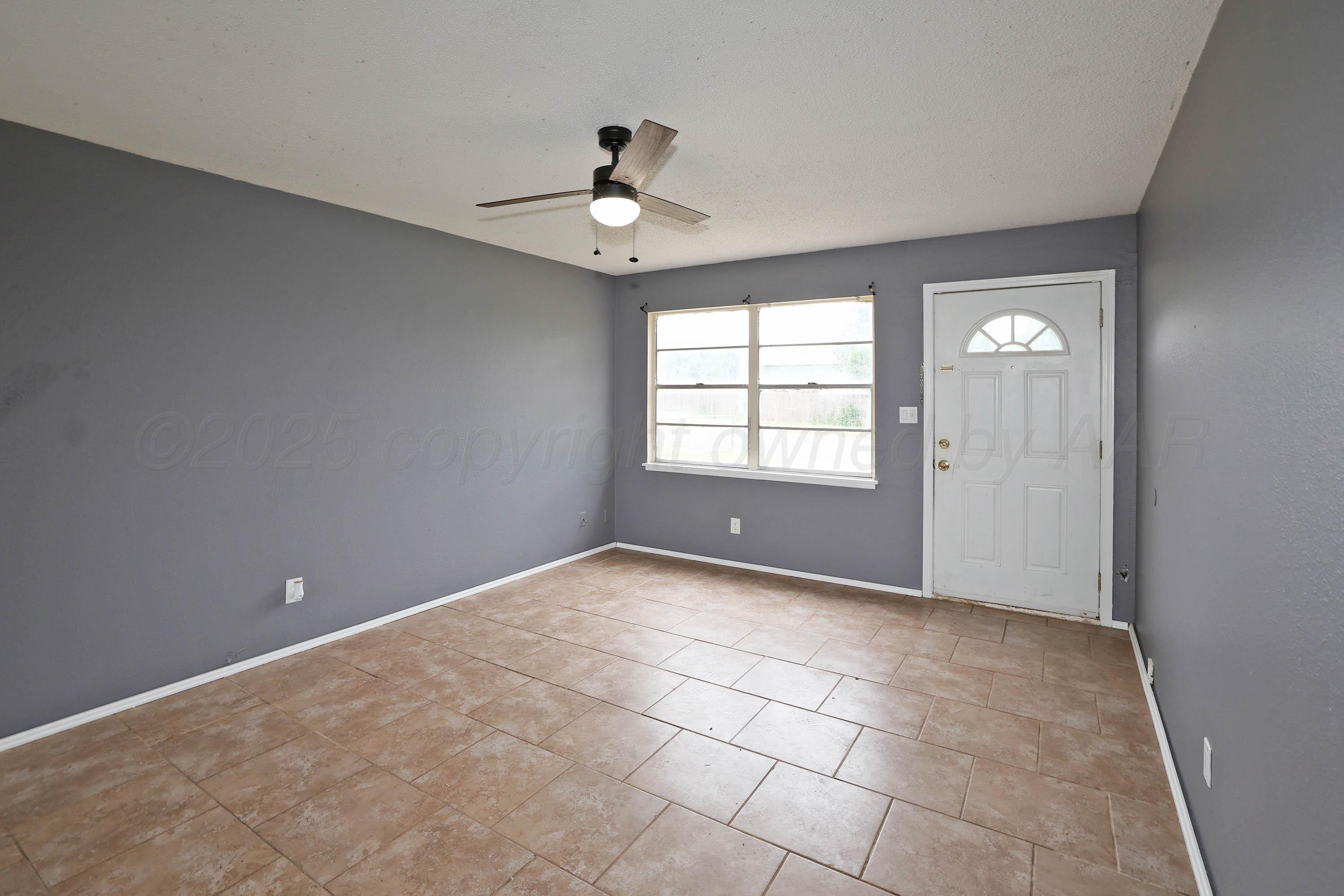 3810 Mesa Verde Drive Amarillo, TX 79107 - Photo 5 of 21 a view of an empty room with a window