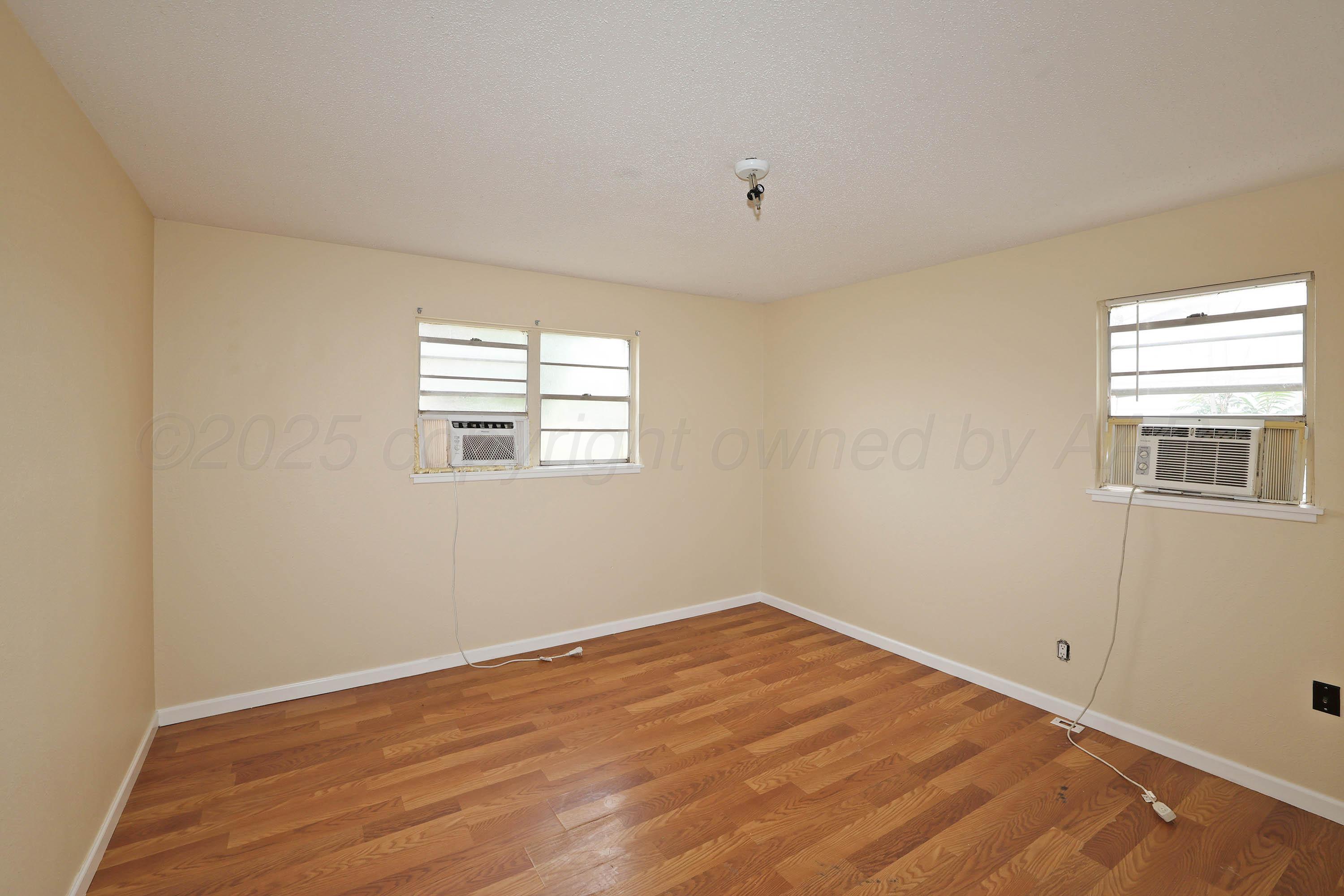 3810 Mesa Verde Drive Amarillo, TX 79107 - Photo 10 of 21 a view of empty room with wooden floor and fan