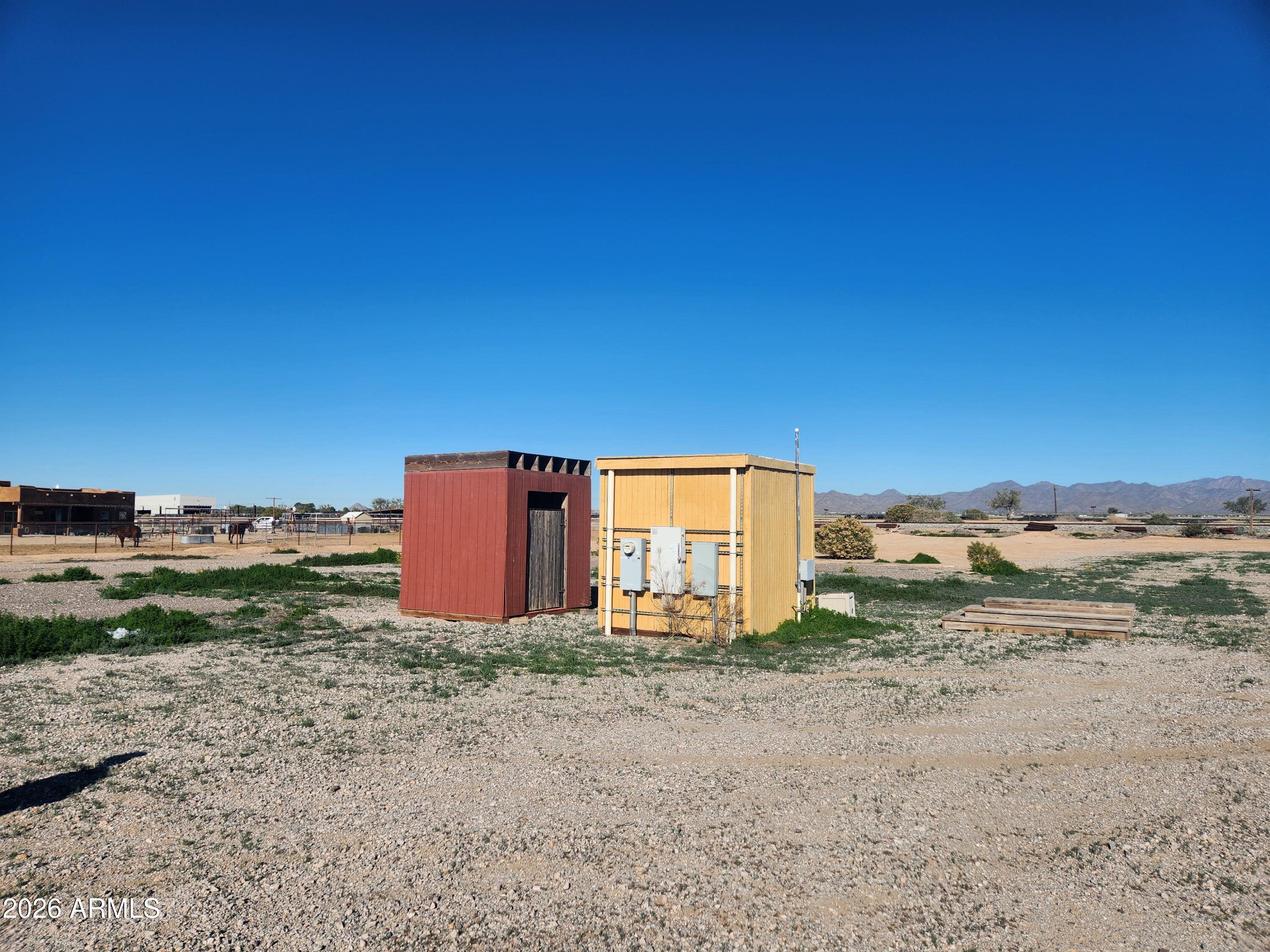 6200 South Dean Road Buckeye, AZ 85326 - Photo 5 of 5 a view of a dry yard with wooden fence