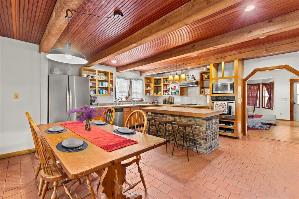 11419 Raschke Run Weeki Wachee, FL 34614 - Photo 11 of 19 a dining room with furniture and wooden floor