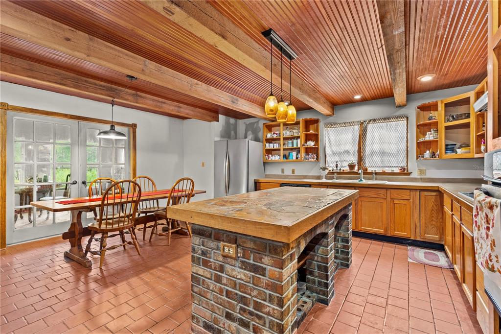 11419 Raschke Run Weeki Wachee, FL 34614 - Photo 12 of 19 a kitchen with lots of counter top space