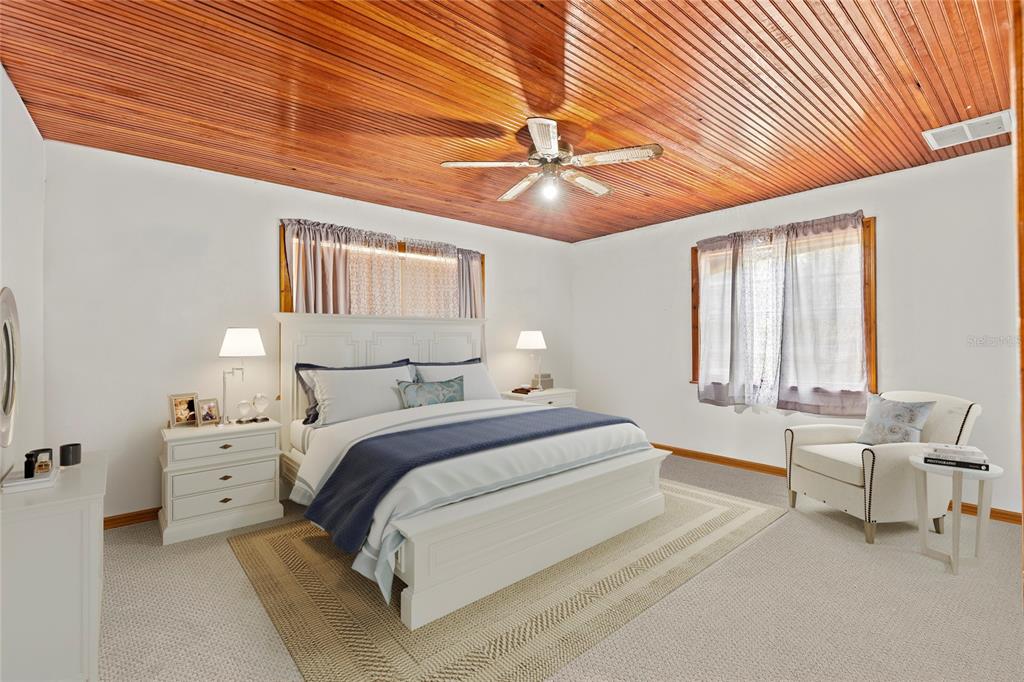 11419 Raschke Run Weeki Wachee, FL 34614 - Photo 14 of 19 a bedroom with bed and window