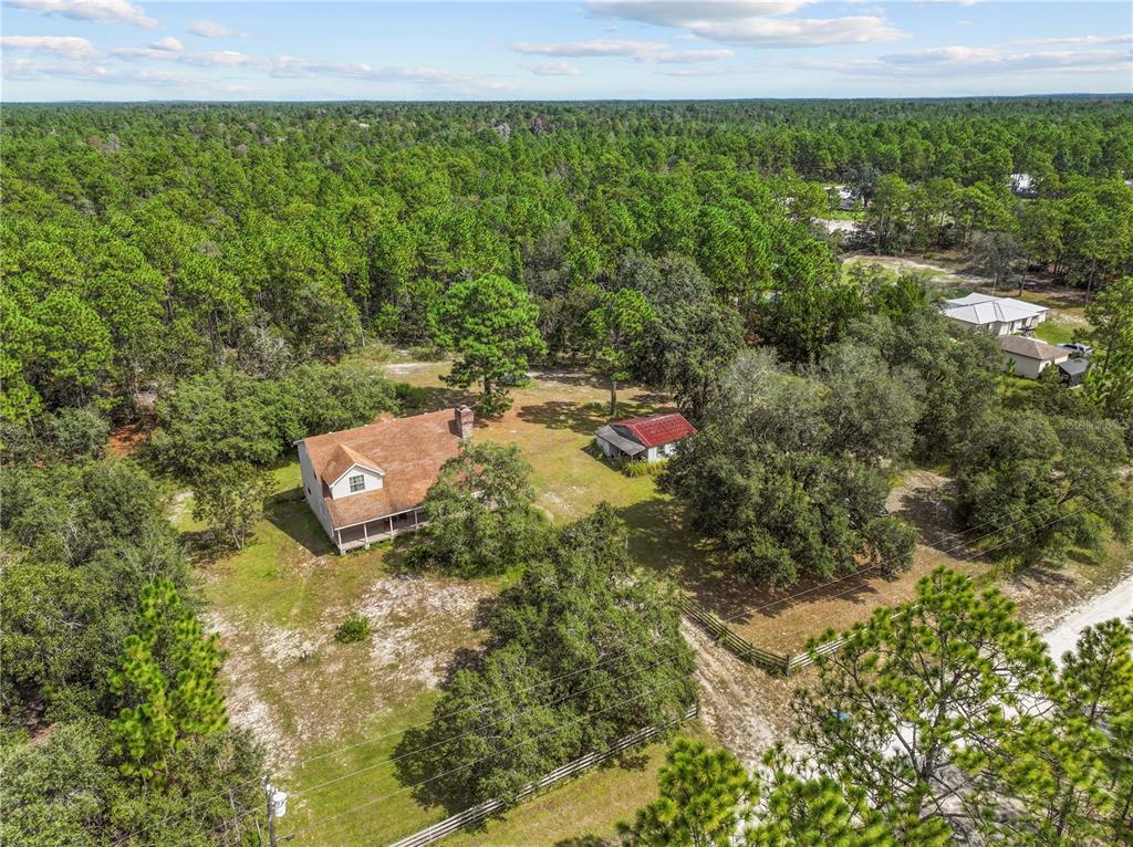 11419 Raschke Run Weeki Wachee, FL 34614 - Photo 18 of 19 a aerial view of a house with a yard