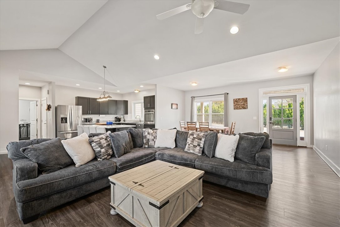 212 Winding Lane Seneca, SC 29672 - Photo 10 of 47 An inviting open-concept living space features warm flooring and abundant natural light.