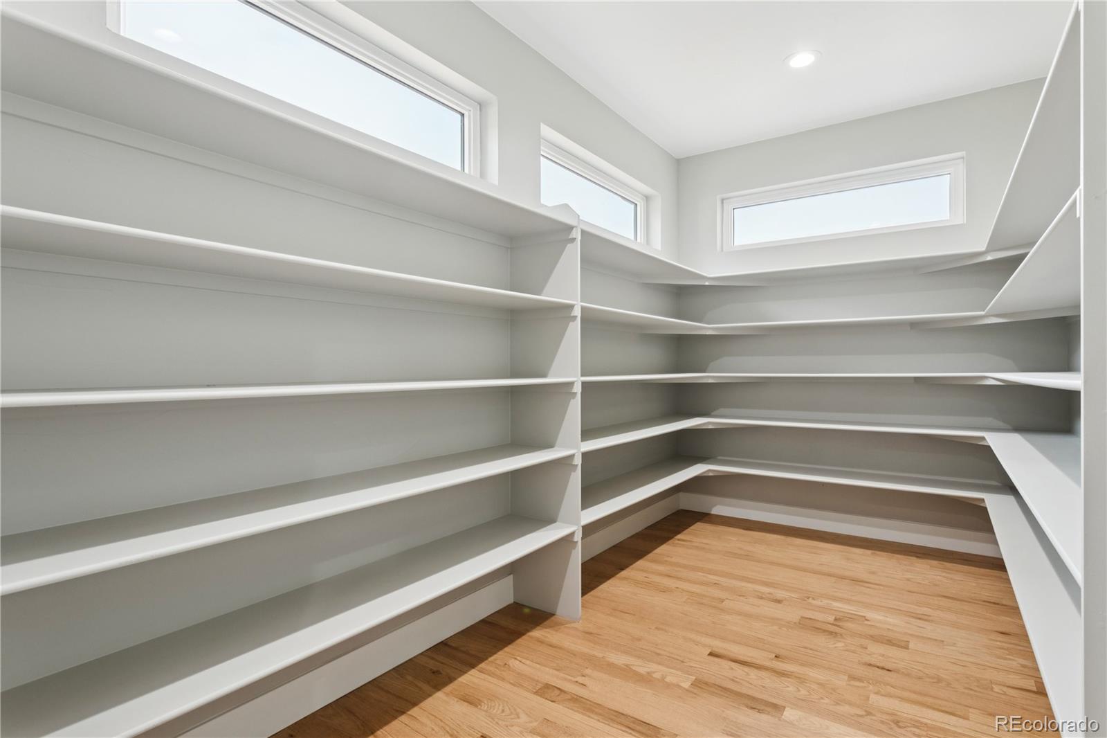 12550 Imboden Road Hudson, CO 80642 - Photo 16 of 50 a view of walk in closet with empty racks