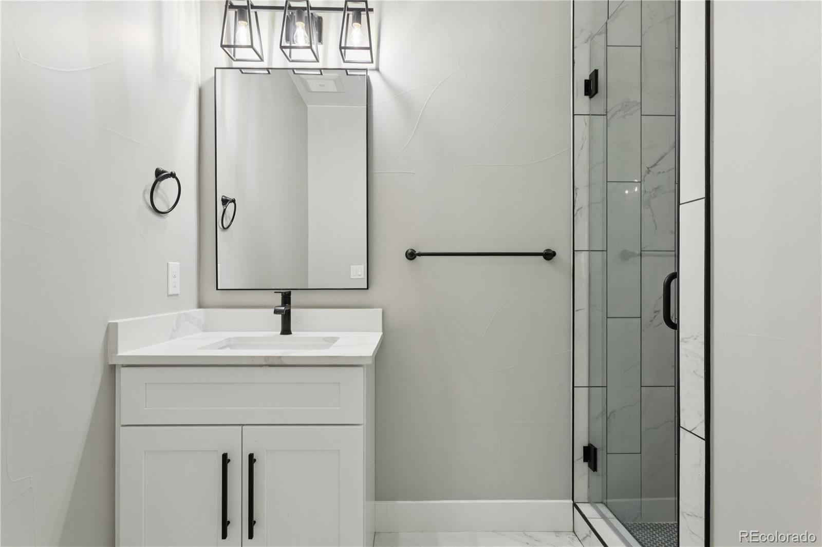 12550 Imboden Road Hudson, CO 80642 - Photo 18 of 50 a bathroom with a sink and a mirror