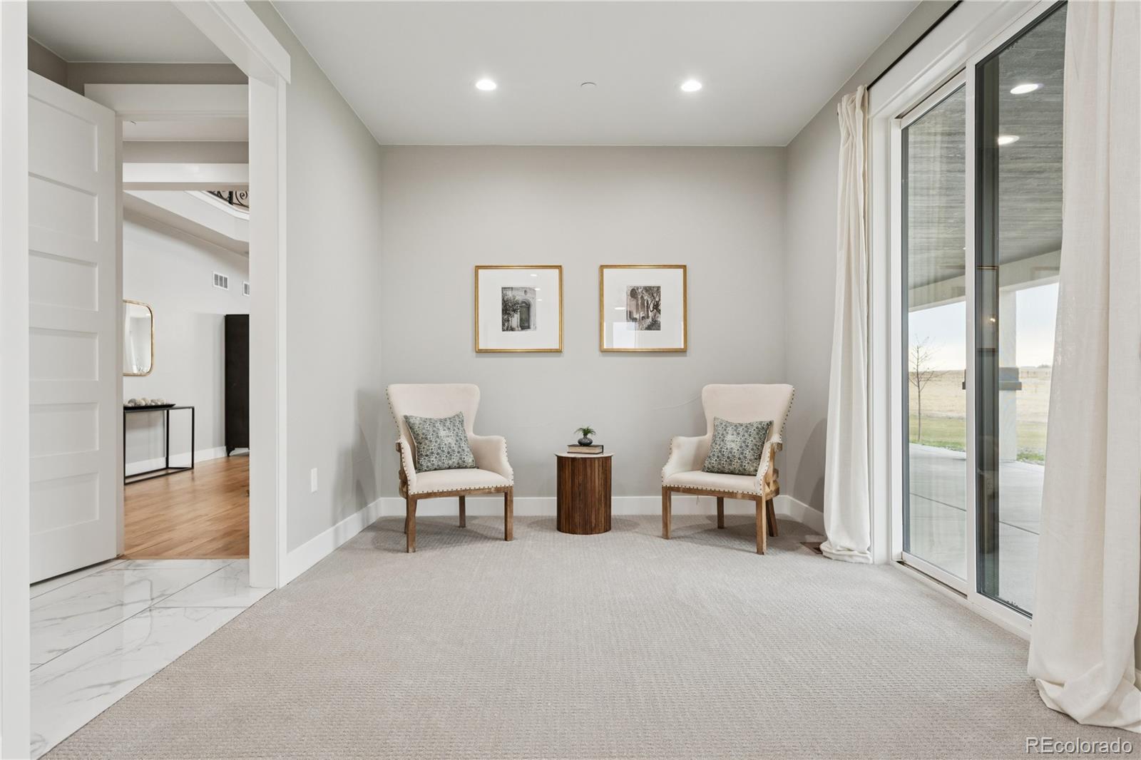 12550 Imboden Road Hudson, CO 80642 - Photo 22 of 50 a living room with furniture and large windows