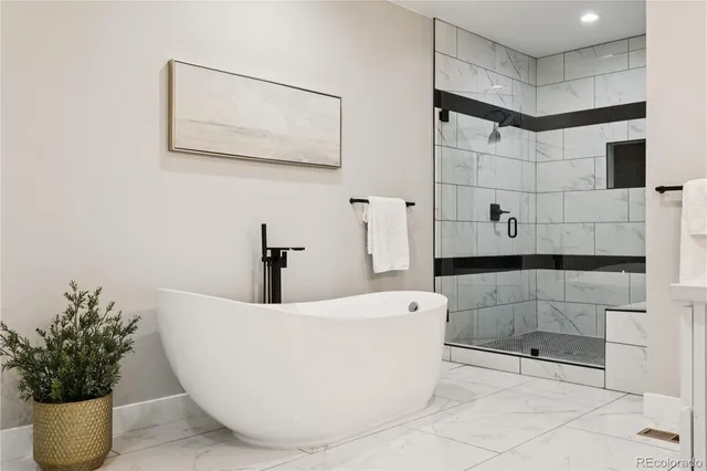a white bath tub sitting in a bathroom