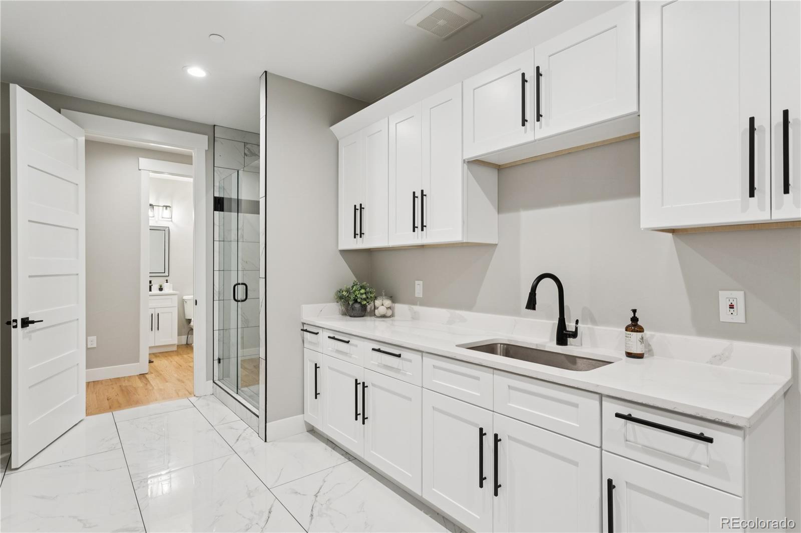 12550 Imboden Road Hudson, CO 80642 - Photo 27 of 50 a kitchen with a sink and cabinets