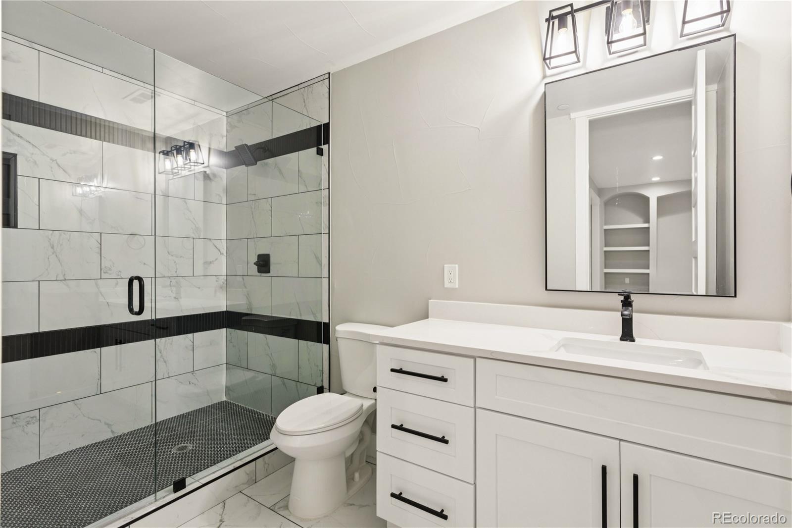 12550 Imboden Road Hudson, CO 80642 - Photo 28 of 50 a bathroom with a sink a toilet and shower