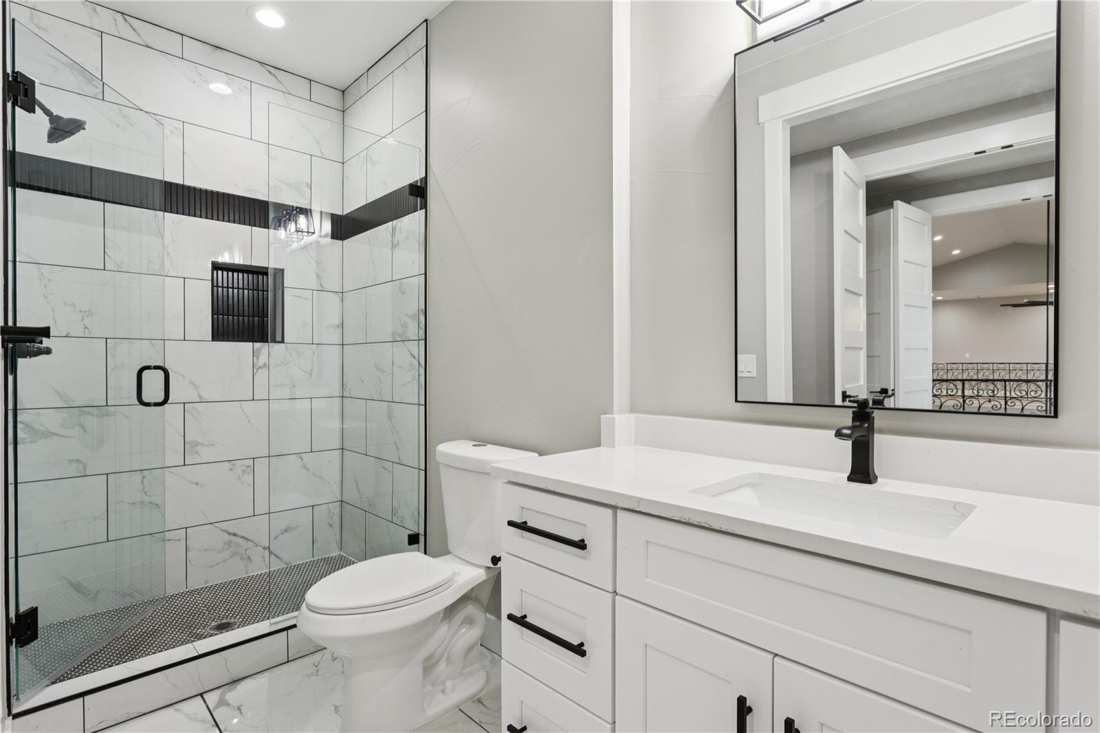 12550 Imboden Road Hudson, CO 80642 - Photo 36 of 50 a bathroom with a sink toilet and shower