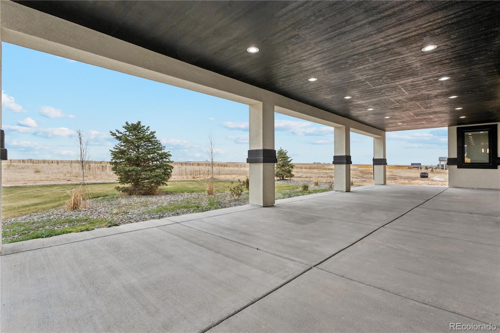 12550 Imboden Road Hudson, CO 80642 - Photo 39 of 50 a view of a building with a garden
