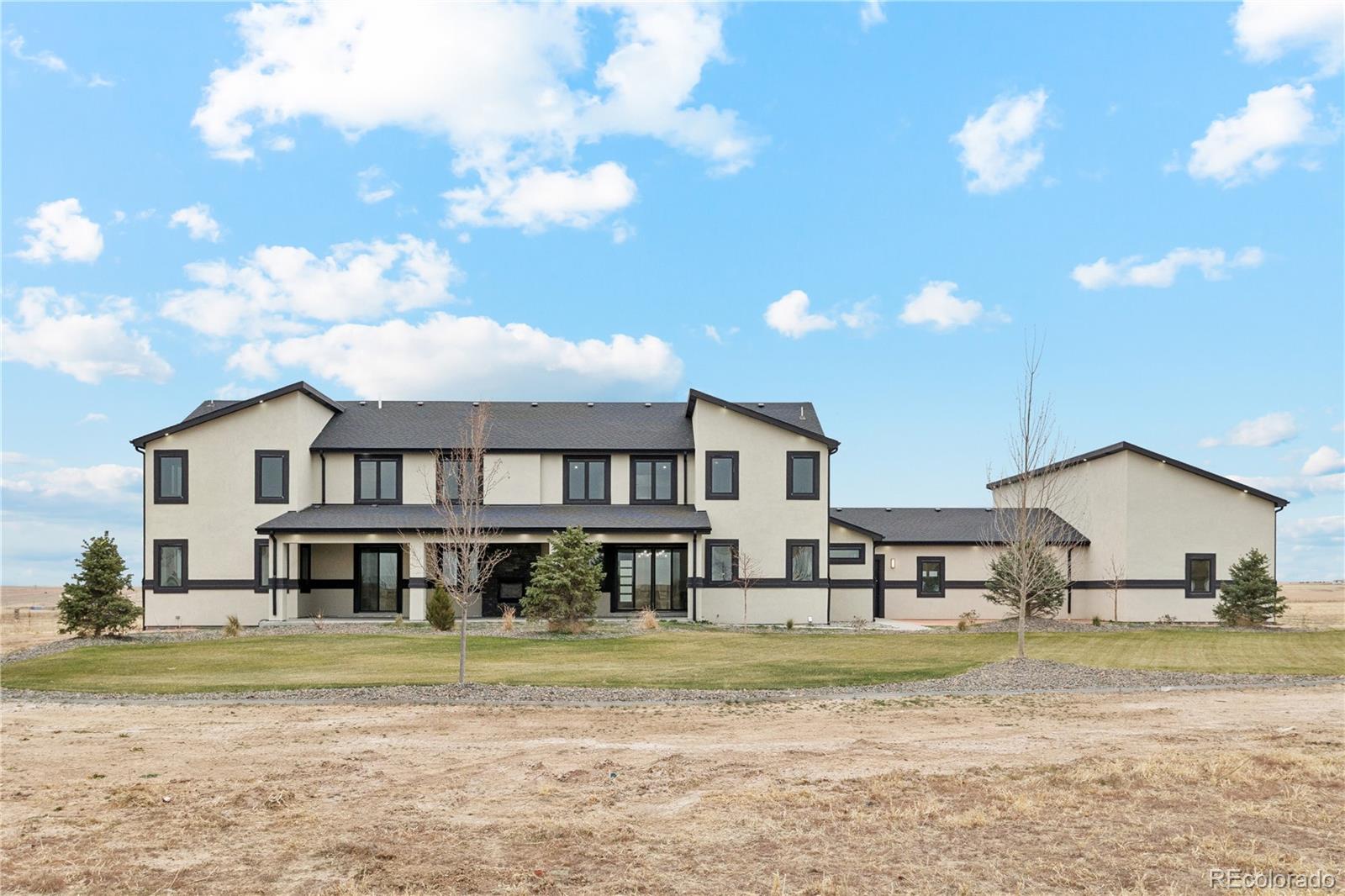 12550 Imboden Road Hudson, CO 80642 - Photo 40 of 50 a view of a big house with a big yard and large tree