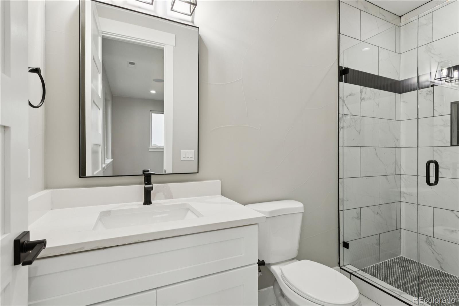 12550 Imboden Road Hudson, CO 80642 - Photo 46 of 50 a bathroom with a sink toilet and shower