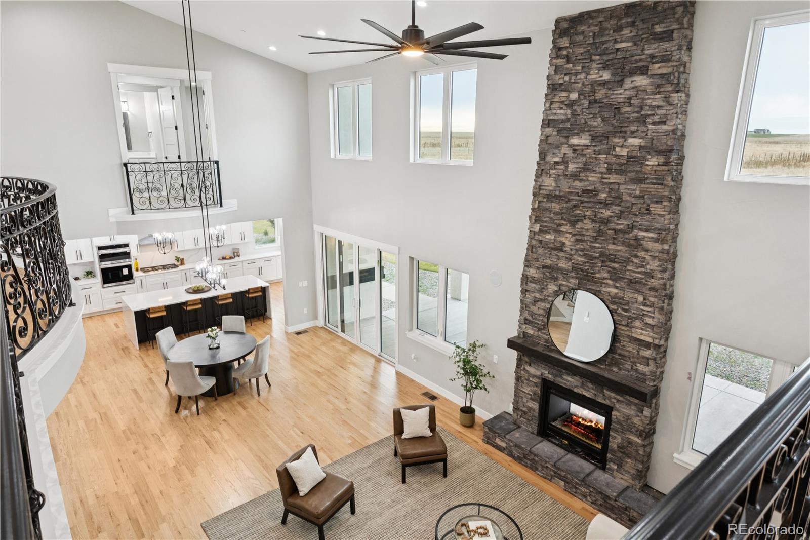 12550 Imboden Road Hudson, CO 80642 - Photo 47 of 50 a bedroom with furniture and a fireplace