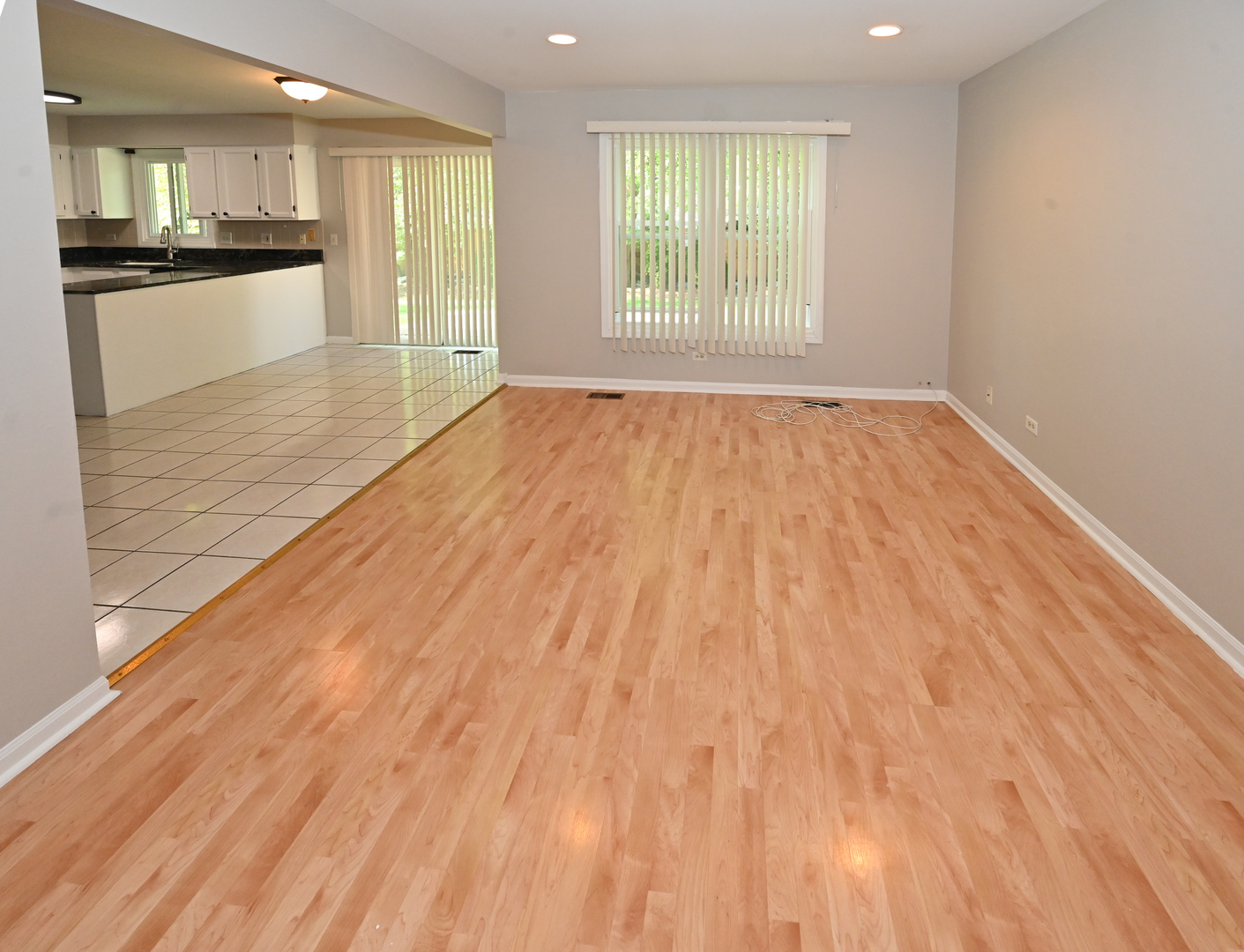 500 Greenview Lane Wheeling, IL 60090 - Photo 11 of 51 a view of an empty room with wooden floor and a window