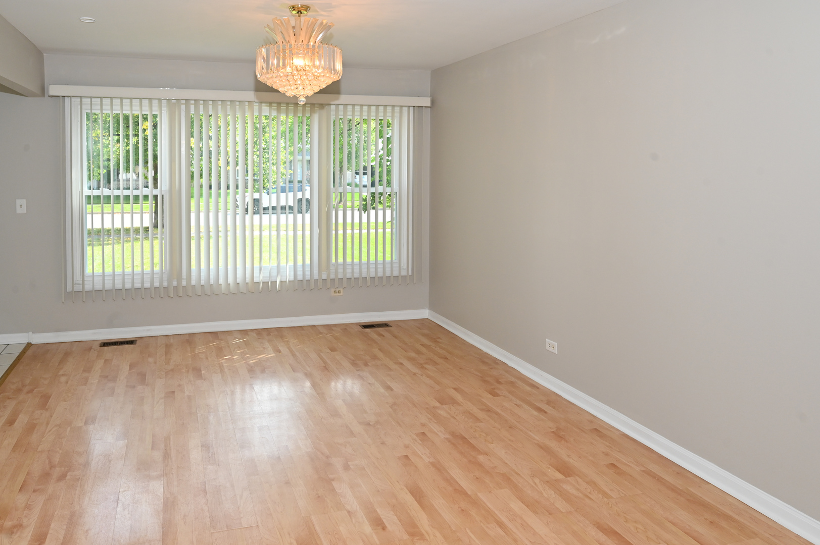500 Greenview Lane Wheeling, IL 60090 - Photo 3 of 51 wooden floor in an empty room with a window
