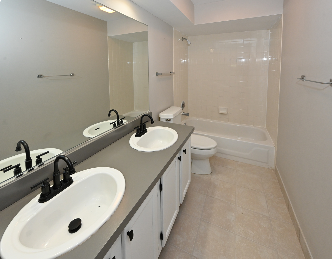 500 Greenview Lane Wheeling, IL 60090 - Photo 34 of 51 a bathroom with a double vanity sink toilet and mirror