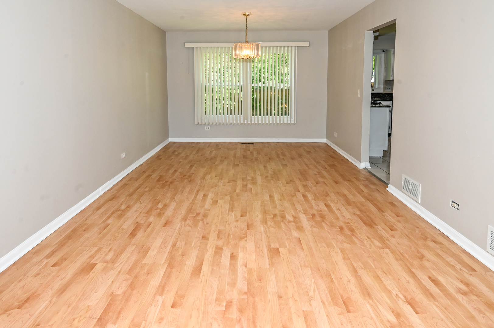 500 Greenview Lane Wheeling, IL 60090 - Photo 5 of 51 a view of empty room with wooden floor and fan