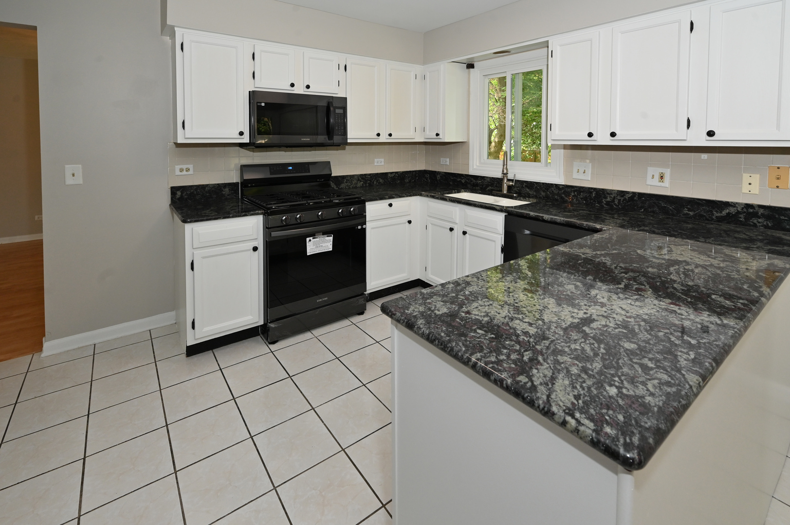 500 Greenview Lane Wheeling, IL 60090 - Photo 6 of 51 a kitchen with stainless steel appliances granite countertop a sink stove and cabinets