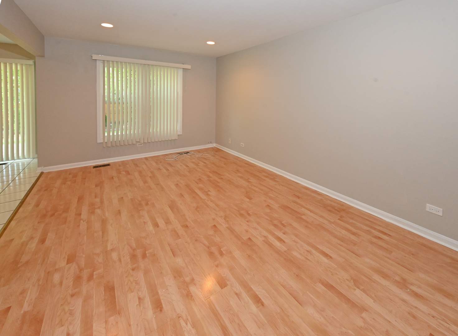 500 Greenview Lane Wheeling, IL 60090 - Photo 10 of 51 an empty room with wooden floor and windows