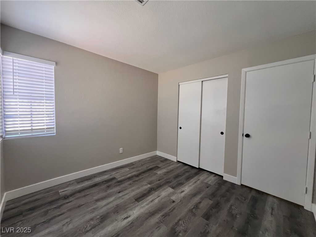 3238 Canyon Terrace Drive Laughlin, NV 89029 - Photo 23 of 41 Unfurnished bedroom with a closet and dark wood-style floors