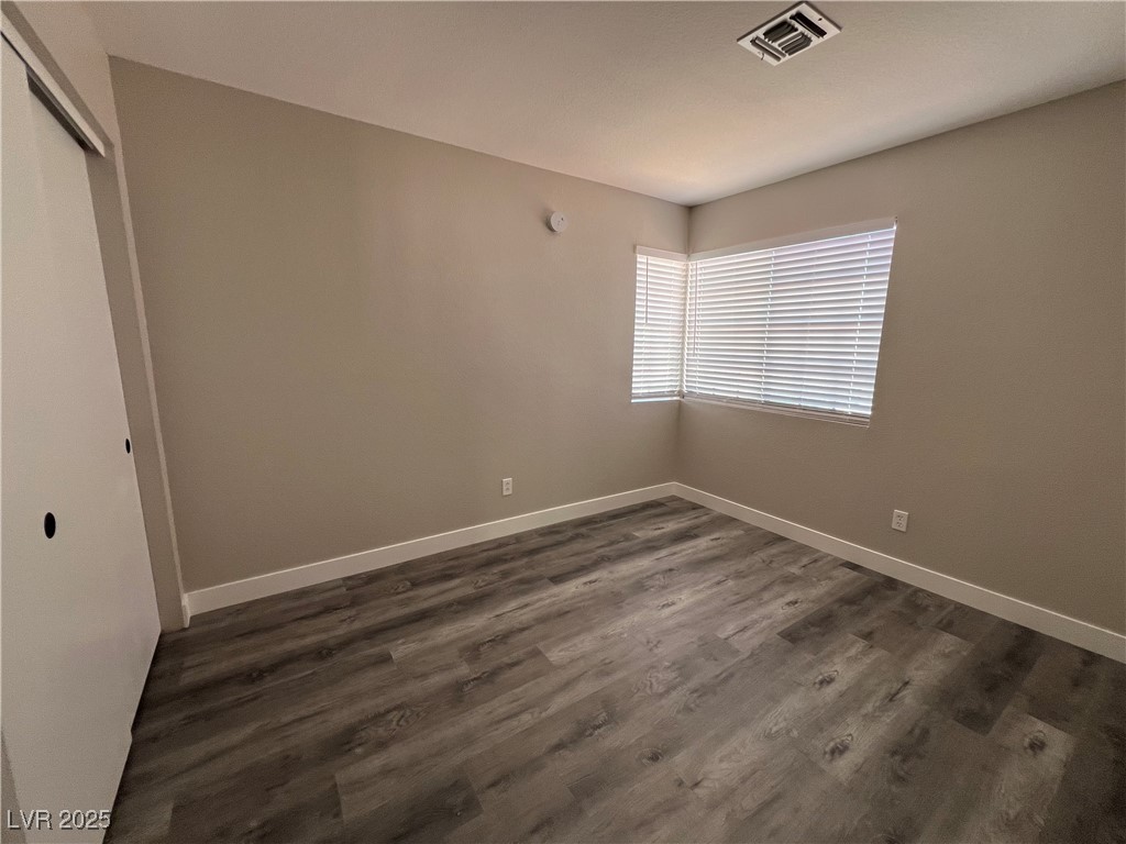 3238 Canyon Terrace Drive Laughlin, NV 89029 - Photo 24 of 41 Unfurnished bedroom with a closet and dark wood-style floors