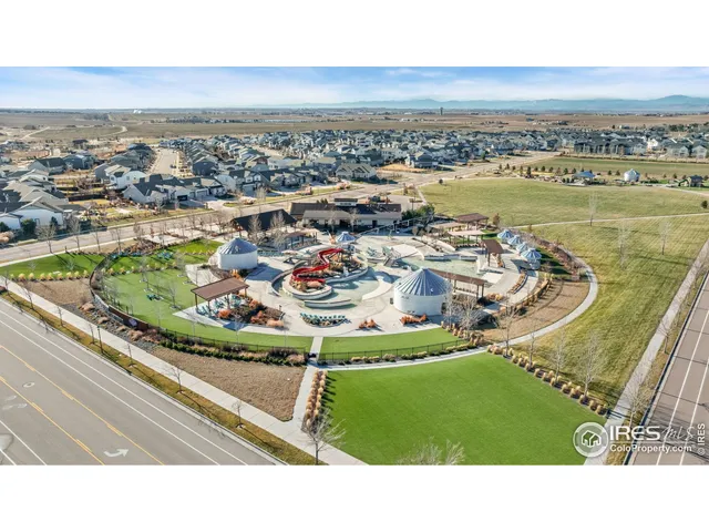 an aerial view of a parking space and city view