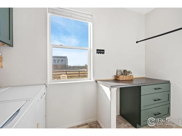 a kitchen with a stove a sink and a cabinets
