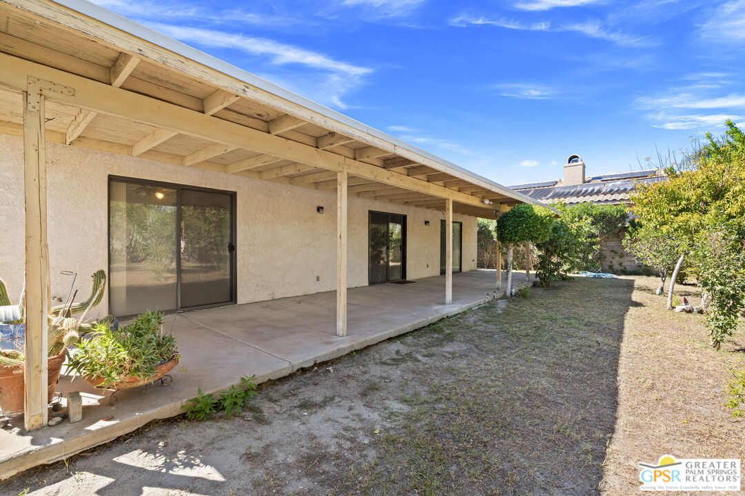 68600 Risueno Road Cathedral City, CA 92234 - Photo 20 of 30 a view of a patio with table and chairs and potted plants