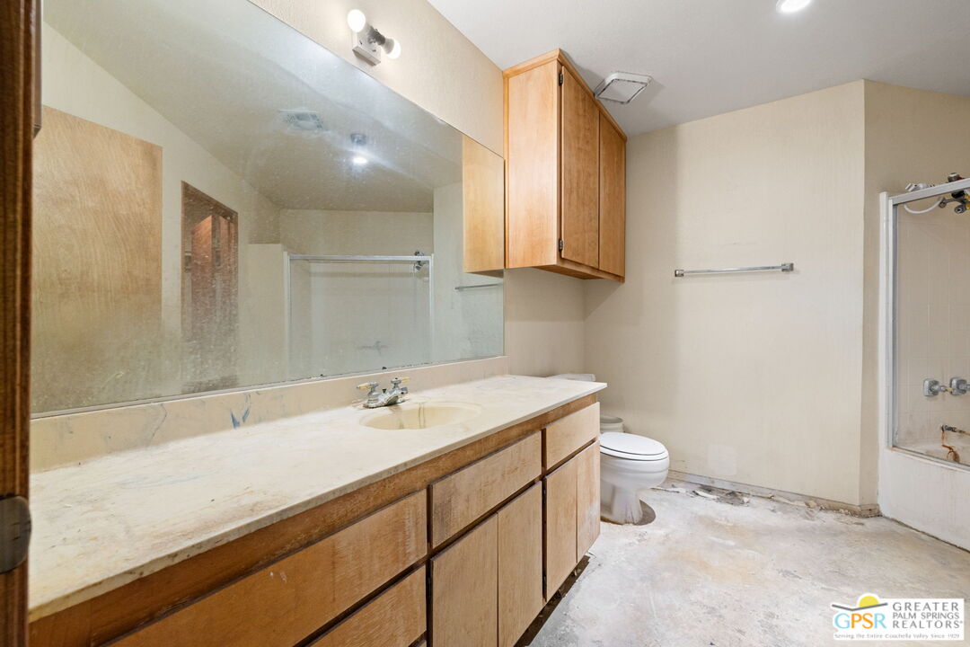68600 Risueno Road Cathedral City, CA 92234 - Photo 23 of 30 a bathroom with a sink a toilet and a mirror