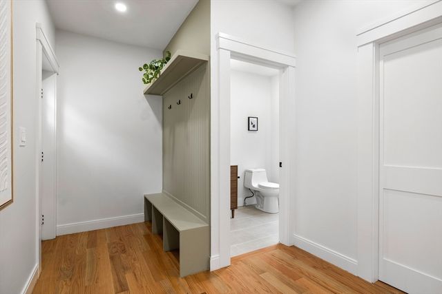 a view of a white house with large windows