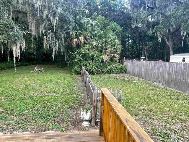 a backyard of a house with lots of green space