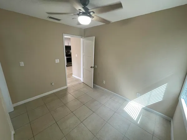 an empty room with a bathroom