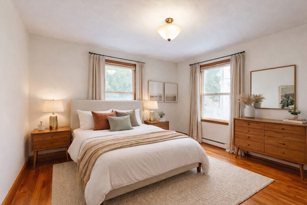 105 Walnut Street, Unit A Somerville, MA 02145 - Photo 5 of 14 a bedroom with a bed and a dresser