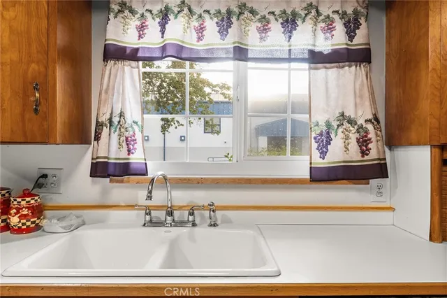 a view of a bathroom with mirror and a bath tub