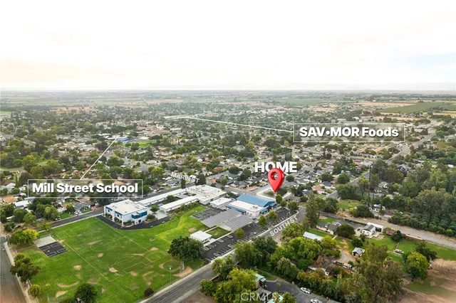an aerial view of residential houses with city view