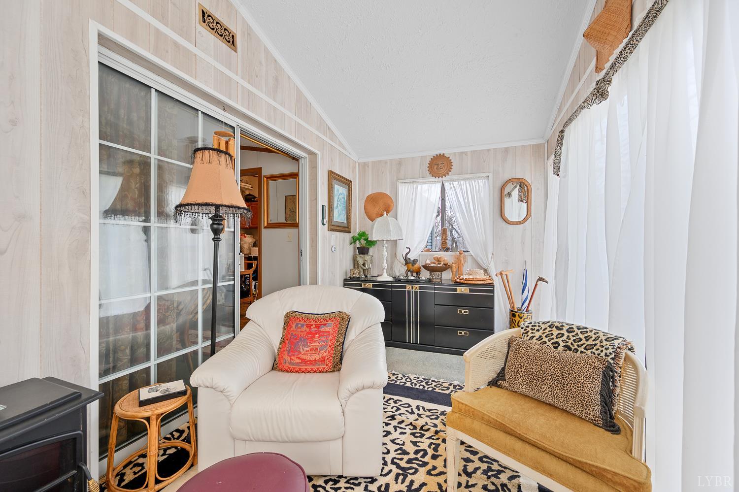 4400 Murray Hollow Road Thaxton, VA 24174 - Photo 34 of 56 a living room with furniture and a rug